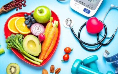 Healthy food items with fruits, vegetables, and medical tools for heart health and fitness