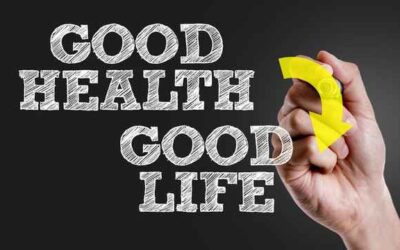 Good Health Good Life hand writing with yellow arrow on black background