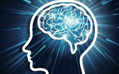 Silhouette of human head with glowing brain and radiant background