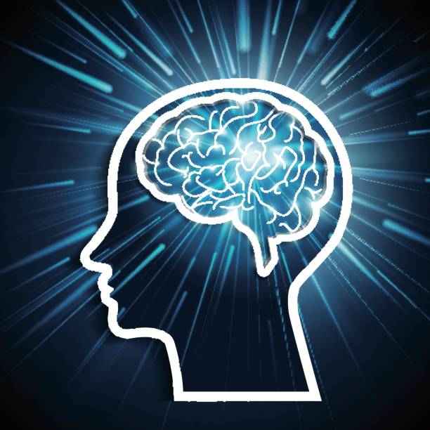 Silhouette of human head with glowing brain and radiant background