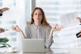 How to Stay Mentally Fit in Busy Life Woman meditating at work amidst office chaos