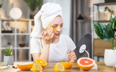 Best Foods for Glowing Skin A woman applying orange slices to her face as part of a natural skincare routine for glowing skin