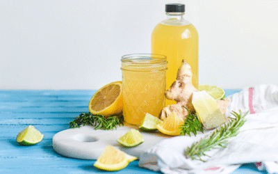 Prebiotic Beverages: A Healthy Trend for Better Gut and Overall Wellness Prebiotic Beverages Homemade ginger lemon detox drink with lime and rosemary on blue wooden table